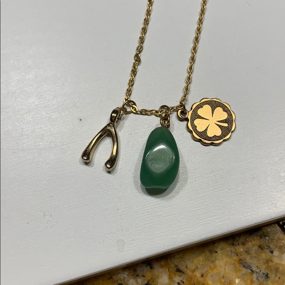 Necklace gold wishbone, green stone and shamrock.